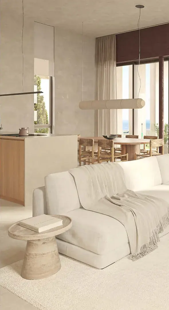 Detail des Wohnzimmers mit Sofa und Essbereich im Hintergrund